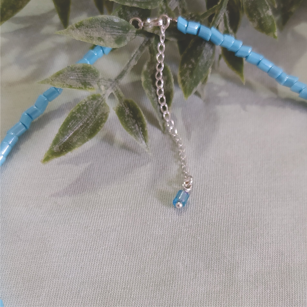 Colar conta cristal de murano azul turquesa e pérola natural banhado em Prata 925