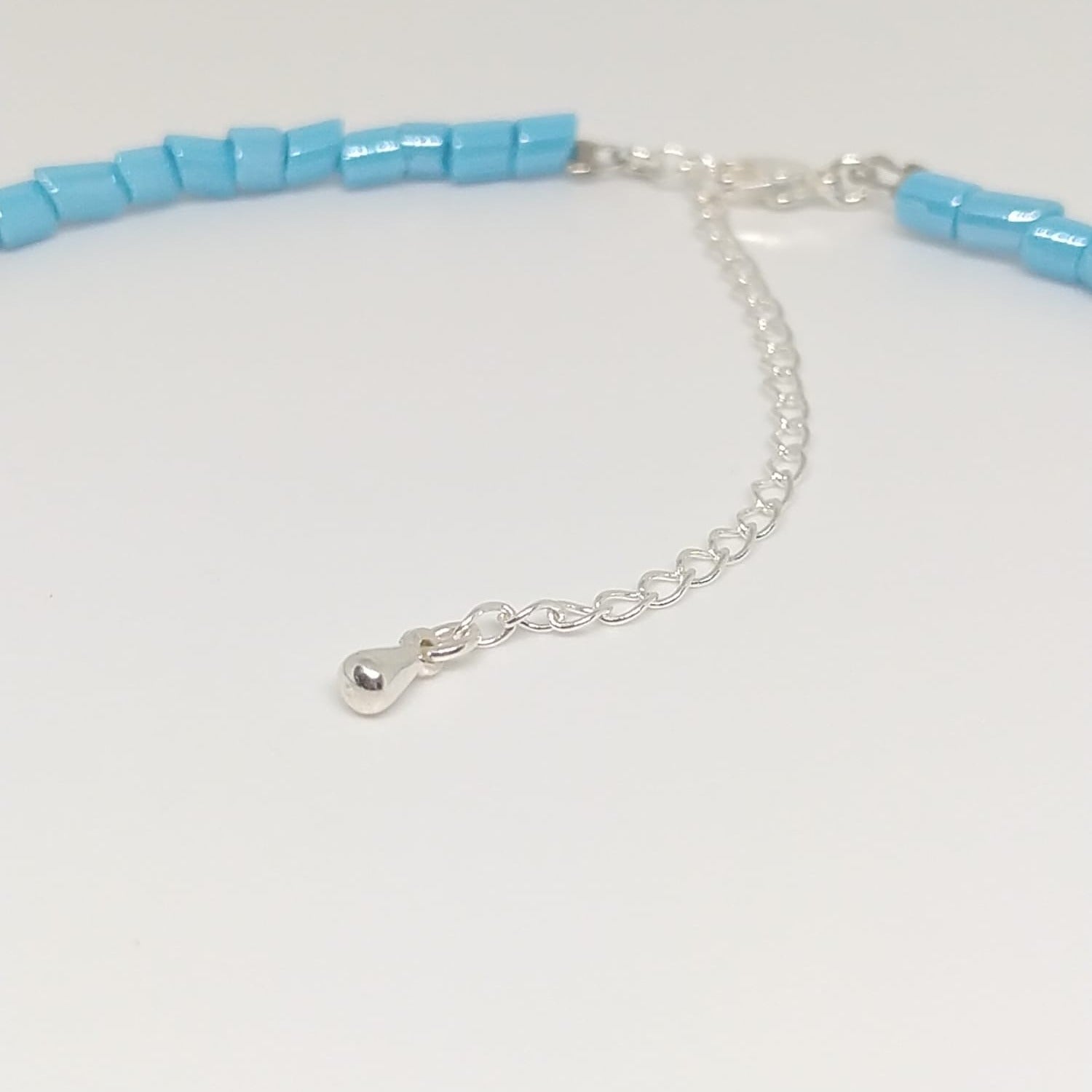 Colar conta cristal de murano azul turquesa e pérola natural banhado em Prata 925